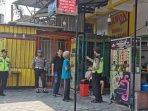 Pihak-kepolisian-mendatangi-binatu-di-Jalan-Raya-Sengkaling-Kecamatan-Dau-Malang-untuk-olah-TKP.jpg