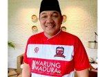 Presiden-Klub-Madura-United-Achsanul-Qosasi-memakai-jersey-anyar-pra-musim-Liga-1-20232024.jpg