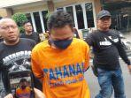 RTH-tersangka-pelaku-mutilasi-wanita-dalam-koper-di-Ngawi-saat-digelandang.jpg