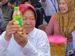 Risma-kaget-dapat-doorprize-minyak-goreng-usai-nyoblos.jpg