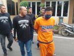 Tersangka-RTH-saat-digelandang-ke-polda-jatim-nngaku-ikah-sirih-hanya-kedok.jpg