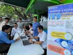 Warga-mengurus-Administrasi-Kependudukan-Adminduk-yang-digelar-Dispendukcapil-Kota-Malang.jpg