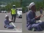 aksi-pria-bersorban-berdoa-di-tengah-jalan-tak-terima-ditilang-minta-polisi-diazab.jpg