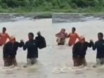 guru-SMPN-7-Bambalamotu-rela-menyeberangi-sungai-dalam-kondisi-banjir-demi-mengajar.jpg