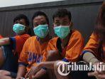 para-tersangka-berinisal-DGP-RNA-AD-OB-dan-CEA-saat-digelandang-anggota-Subdit-IV.jpg