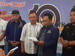 sekretaris-dpd-partai-nasdem-ainul-fuad-membacakan-sikap-partai.jpg