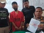 tersangka-baju-orange-saat-berada-di-kantor-polsek-sampang.jpg