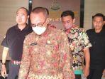 tersangka-dua-asn-yakni-bp-lurah-gadingrejo-depan-dan-hy-staff-kelurahan.jpg