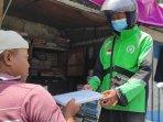 warga-Kelurahan-Mojorejo-Kota-Madiun-mengirimkan-barang-dagangannya-menggunakan-Gojek.jpg