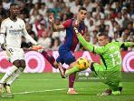 Ferran-Torres-vs-Andriy-Lunin-di-Liga-Spanyol-antara-Real-Madrid-vs-Barcelona-di-stadion-Bernabeu.jpg