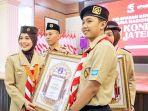 Siti-Atikoh-Ganjar-Pranowo-saat-melepas-kontingen-Jawa-Tengah-ke-Rainas-XII-tahun-2023.jpg