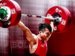catatkan-total-angkatan-318-kilogram-deni-berpeluang-tambah-medali-emas-bagi-indonesia_20180822_165608.jpg