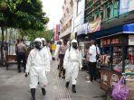 penyemprotan-kawasan-malioboro-oleh-satuan-petugas-pencegahan-covid-19-polda-diy.jpg