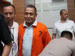 polisi-menggiring-bagus-bawana-putra-bbp-kasus-hoaks-surat-suara.jpg