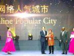 risma-menerima-penghargaan-the-guangzhou-international-award.jpg
