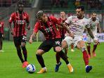 theo-hernandez-vs-luca-ceppitelli-di-liga-italia-antara-ac-milan-vs-cagliari-29-agustus-2021.jpg