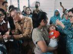 pemberian-vitamin-bagi-anak-dan-Balita-di-Posyandu-Malinau-srs.jpg