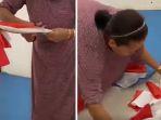 wanita-gunting-gunting-bendera-merah-putih.jpg