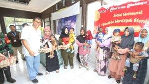 program-stunting-pembangian-telur-hut-tribunkalteng.jpg