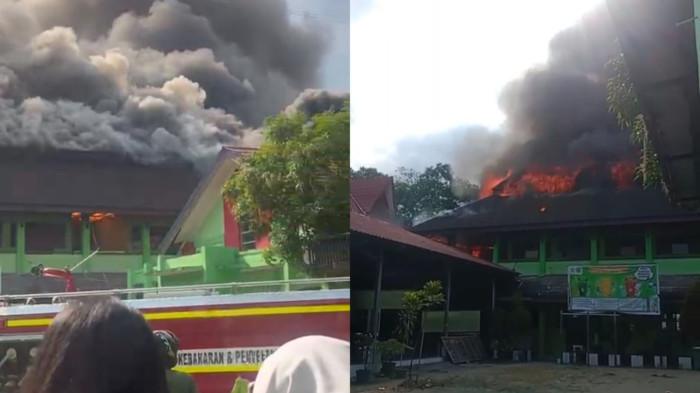 ASAP MEMBUBUNG TINGGI - Kebakaran terjadi di SMP Negeri 2 Samarinda pada Rabu (01/04/2026) sore. Asap pekat hitam terlihat membumbung tinggi dari area sekolah, memicu kepanikan di sekitar lokasi. (TRIBUNKALTIM.CO)