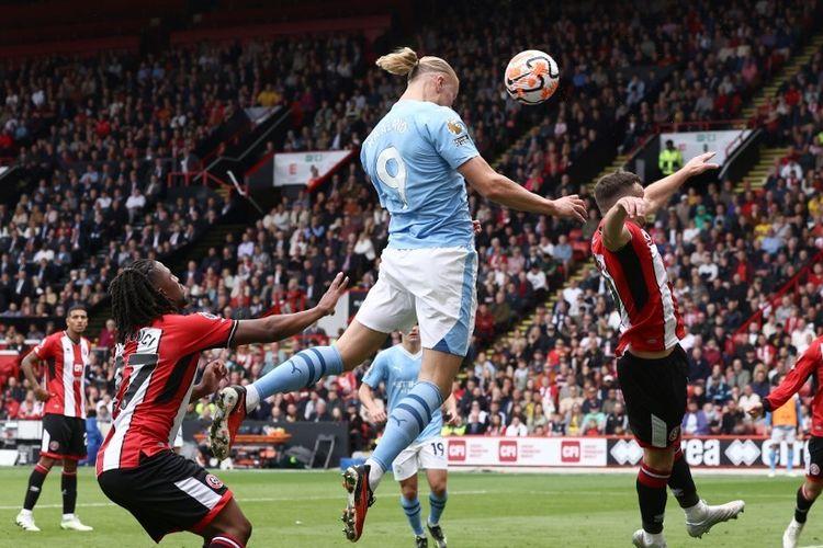 Erling-Haaland-melompat-untuk-mencetak-gol-untuk-Manchester-City-vs-Sheffield-United.jpg