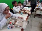20241104_POlres-Kukar-bagi-makanan-bergiizi-kepada-siswa-SD.jpg