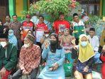 Bupati-Wabup-Kukar-Edi-Damansyah-dan-Rendi-Solihin-saat-menyerahkan-bantuan.jpg