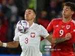 Jakub-Kiwior-kiri-yang-juga-rekan-Robert-Le.jpg