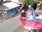 Oknum-polisi-bertikai-dengan-warga-yang-berujung-perusakan-mobil.jpg