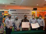 PT-Komatsu-dan-BPJamsostek-saatb-melakukan-penandatanganan-kerja-sama.jpg