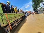air-pasang-menggenangi-jalanan.jpg