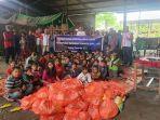 Foto-bersama-INTI-NTT-setelah-berbagi-kasih-bersama-35-keluarga.jpg
