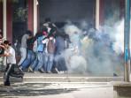 Mahasiswa-dari-sejumlah-universitas-di-Dili-berlarian-dari-gas-air-mata.jpg