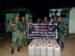 anggota-satgas-pamtas-yonif-raider-408sbh-mengamankan-bbm-jenis-minyak-tanah.jpg