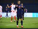 antoine-griezmann-merayakan-gol.jpg
