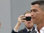 ekspresi-pemain-baru-juventus-cristiano-ronaldo_20180721_143952.jpg