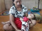 leha-menunjukkan-potret-salah-satu-anaknya-yang-meninggal_20181023_082921.jpg