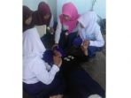 para-siswa-smpn-2-sulamu-yang-mengalami-kesurupan_20181001_161414.jpg