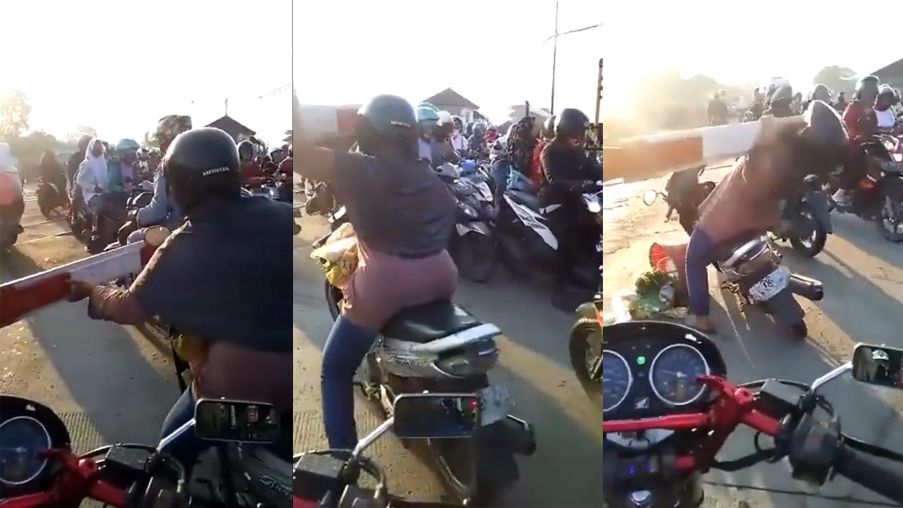 Video Viral Emak-emak Nekat Terobos Palang Pintu Kereta Api, Endingnya Terjatuh