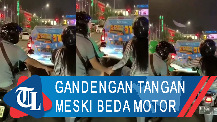 naik-ojol-beda-motor-dua-sejoli-tetap-gandengan-tangan.jpg