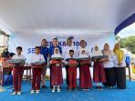 BFI Finance Bagikan Seribu Paket Sepatu dan Tas Sekolah di  Lampung Tengah