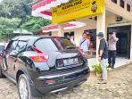 Satu-unit-Nissan-Juke-warna-hitam-dengan-pelat-nomor-BE-1397-KV.jpg