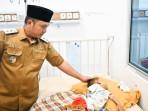 Wakil-Bupati-Pesawaran-jenguk-balita-gizi-buruk.jpg