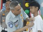 gelar-edukasi-keselamatan-lalu-lintas-melibatkan100-peserta-dari-SMPN5465.jpg