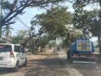 jalan-ryacudu-disiram-air-bersih.jpg