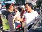 polantas-berkelahi-dengan-pengendara_20181026_081304.jpg