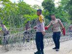 Jaga-Keamanan-Polres-Bima-Pasangan-Kawat-Barrier-di-Kantor-KPU-Warga-Diminta-Hormati-Proses-Pemilu.jpg