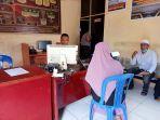 pelapor-sri-rahma-saat-menyampaikan-laporan-di-spkt-polres-bima-kota.jpg