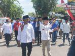 Ratusan-massa-lintas-parpol-pengusung-mengantarkan-pasangan-Lukman-Hakim.jpg