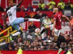 Striker-Crystal-Palace-Jean-Philippe-Mateta-berduel-dengan-pemain-Manchester-United-Sofyan-Amrabat.jpg